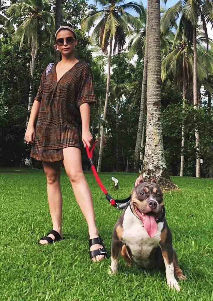 female celebrity walking her pet dog
