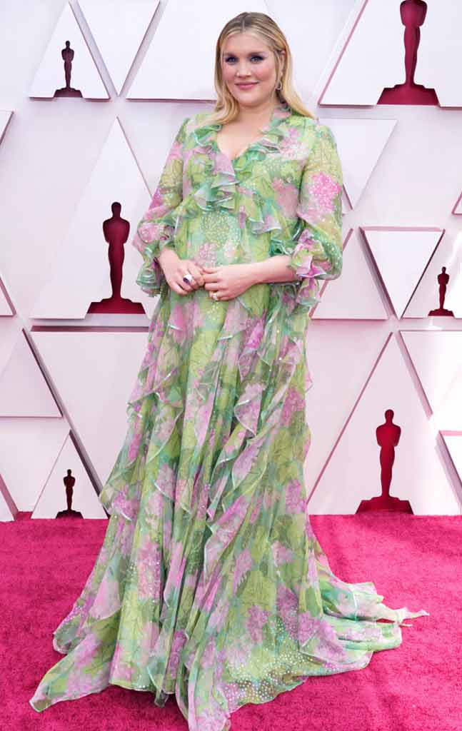 Emerald Fennel in her light green gown for an Oscar's maternity look