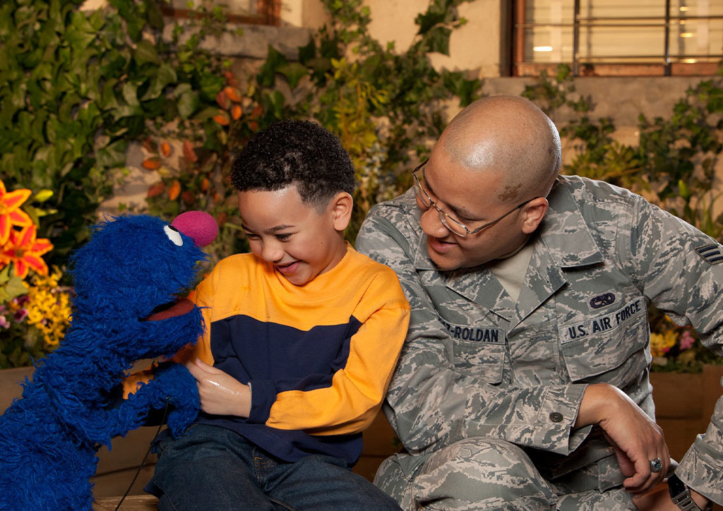 Grover from Sesame Street speaks to a kid and parent on the subject of military families.
