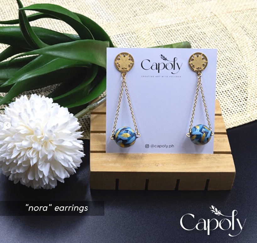 If not pearl and semi-precious, why not try Capoly's clay dangling earrings?