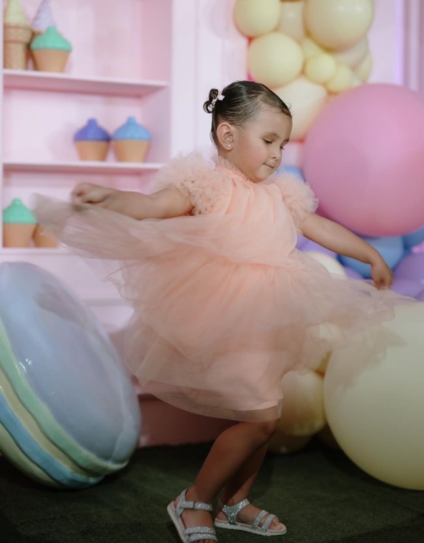 Zoe Miranda in her peach-colored birthday dress by Joe San Antonio.