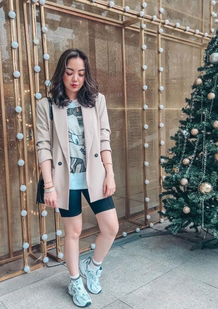 Sheila Dy-Tiu upgraded her casual Looney Tunes shirt, shorts, and New Balance rubber shoes to smart casual with a beige blazer to match.