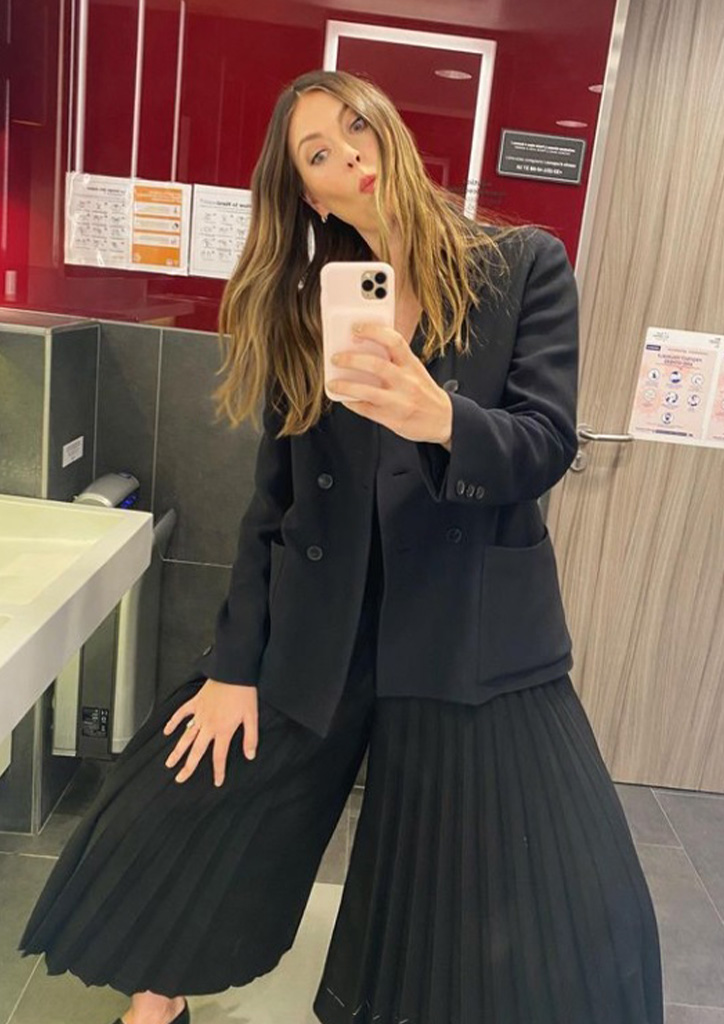 Maria Sharapova in a black blazer and pleated wide-leg pants.