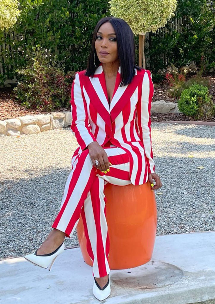 Celebrity mom to twins and Black Panther actress Angela Bassett goes with a red and white striped blazer and pants set.