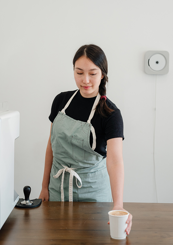 A service worker with a cup of coffee