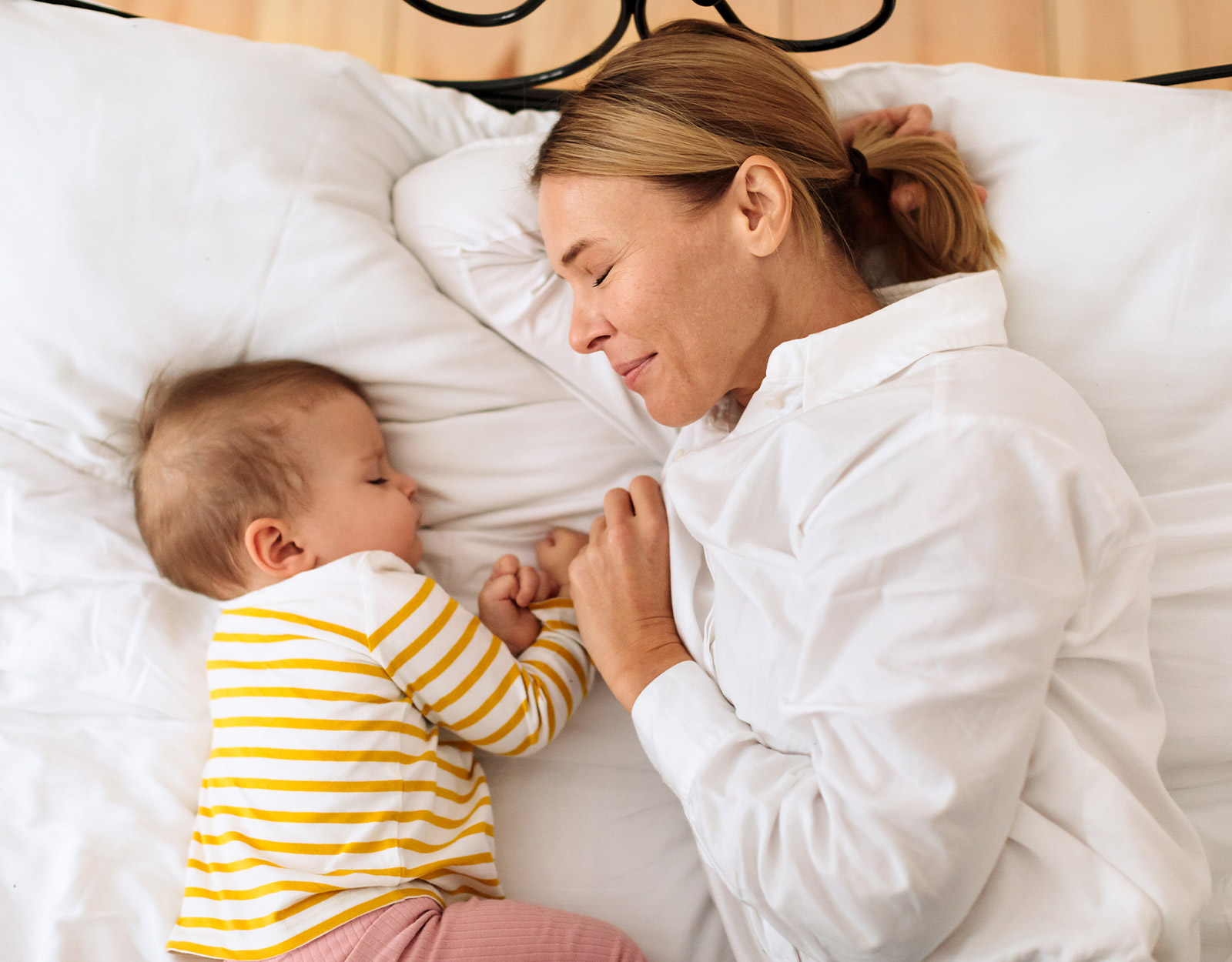 A mom and baby co-sleeping