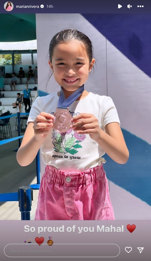 Zia Dantes shows off her medal