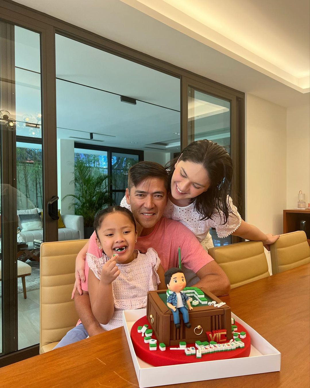 Vic Sotto celebrating his birthday with Pauleen Luna and their daughter, Tali.