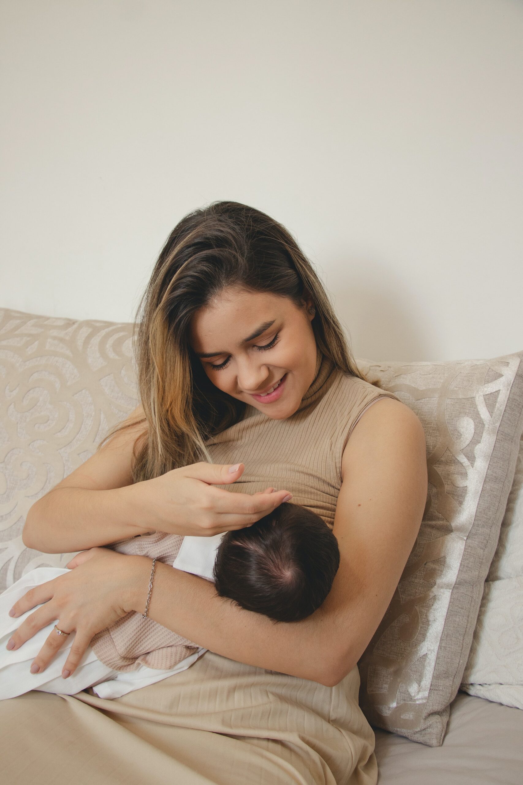 A mom breastfeeding her sleeping baby