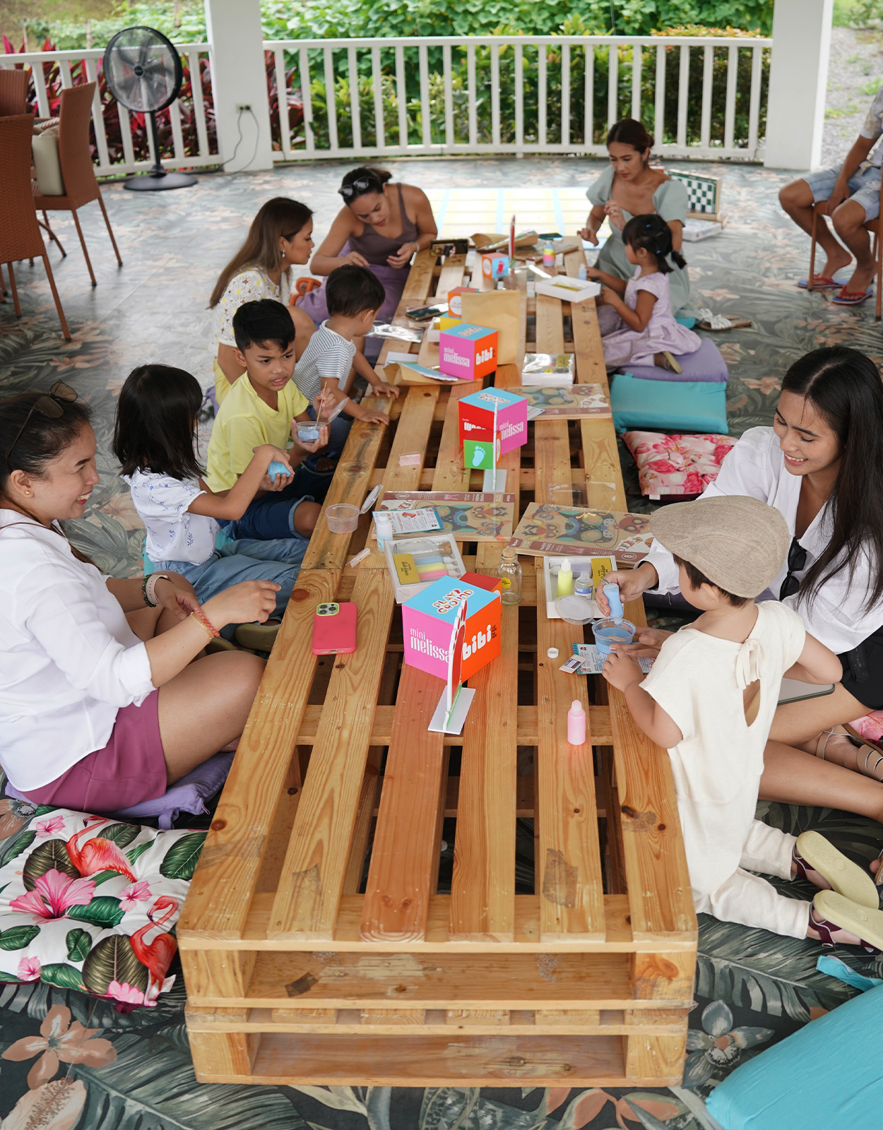 Moms and kids bond at the gazebo over interactive arts and crafts, and educational activities