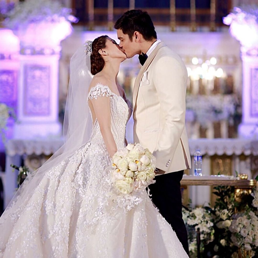 Dingdong Dantes and Marian Rivera sealing their wedding vows with a kiss