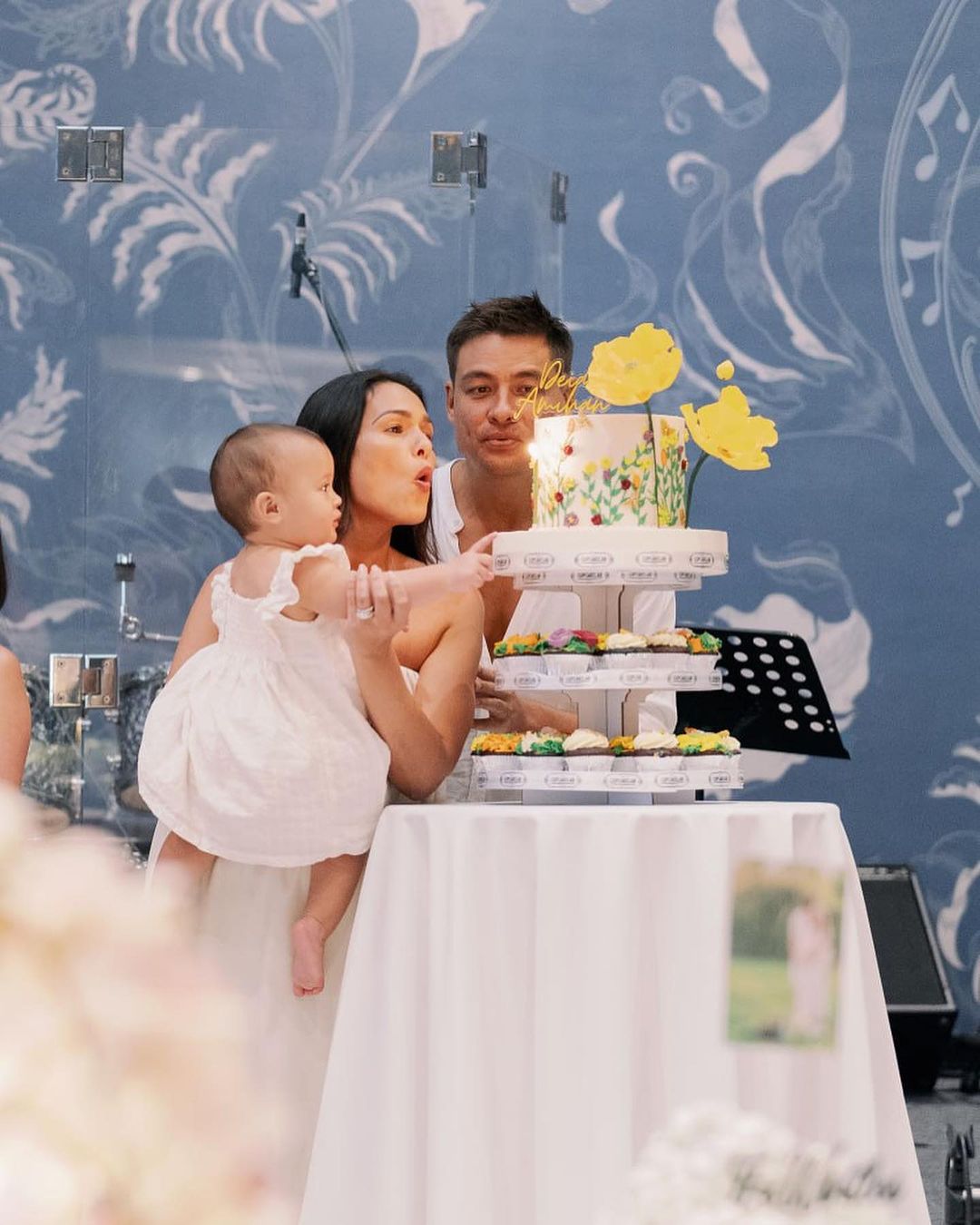 Iza Calzado with Ben Wintle and Deia Amihan blowing out their Christening Cake