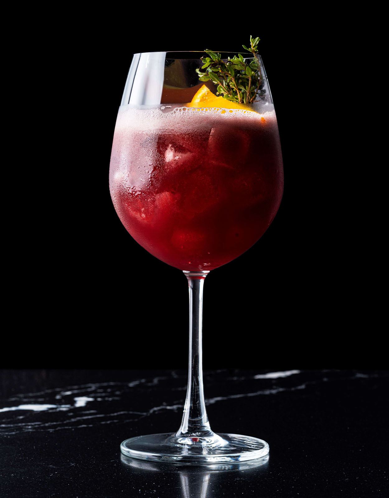 Sangria Tinto: red wine infused with fruits, dried orange, and rosemary